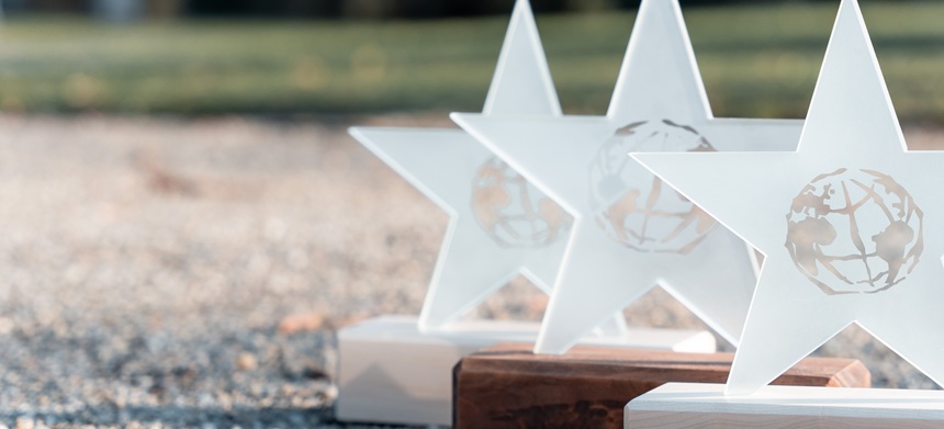 Close-up of the Climate Star Awards consisting of a wooden base and glass star