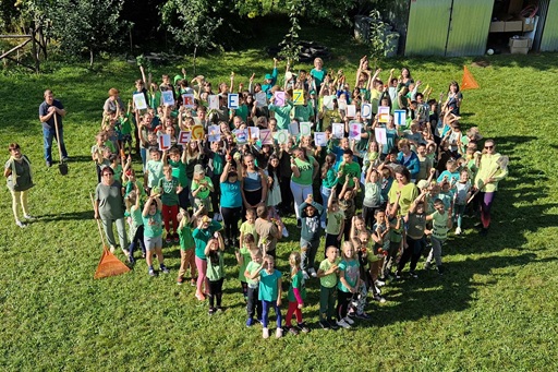 Group photo of children holding signs