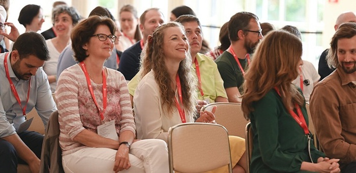 women in the audience looking at the stage